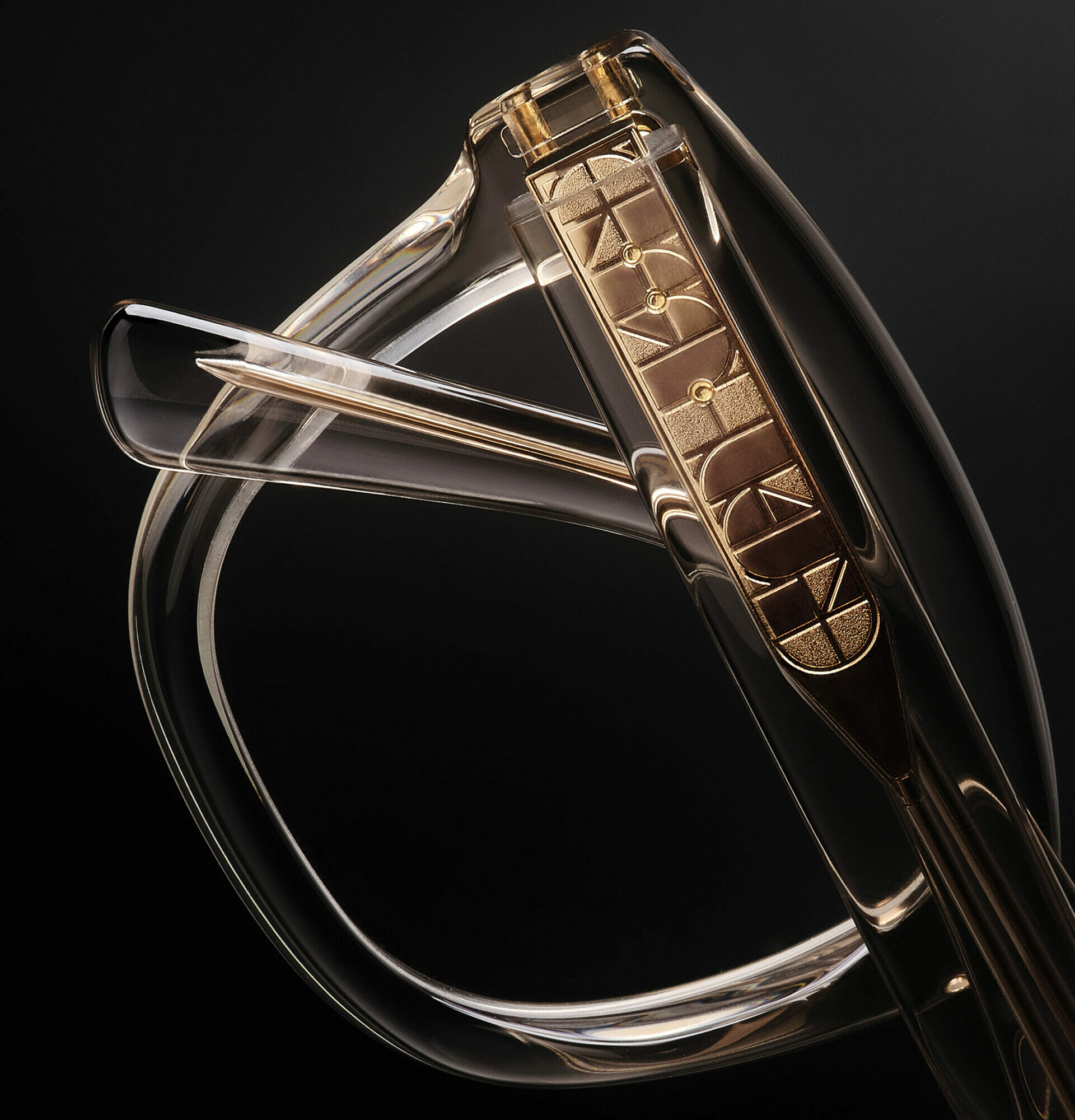 Detail shot of a clear ANDY WOLF frame to show the patterned metal inlay